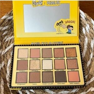 Rude X Peanuts. Shades of Peanuts Warm-tone Eyeshadow Palette. Has a mir…